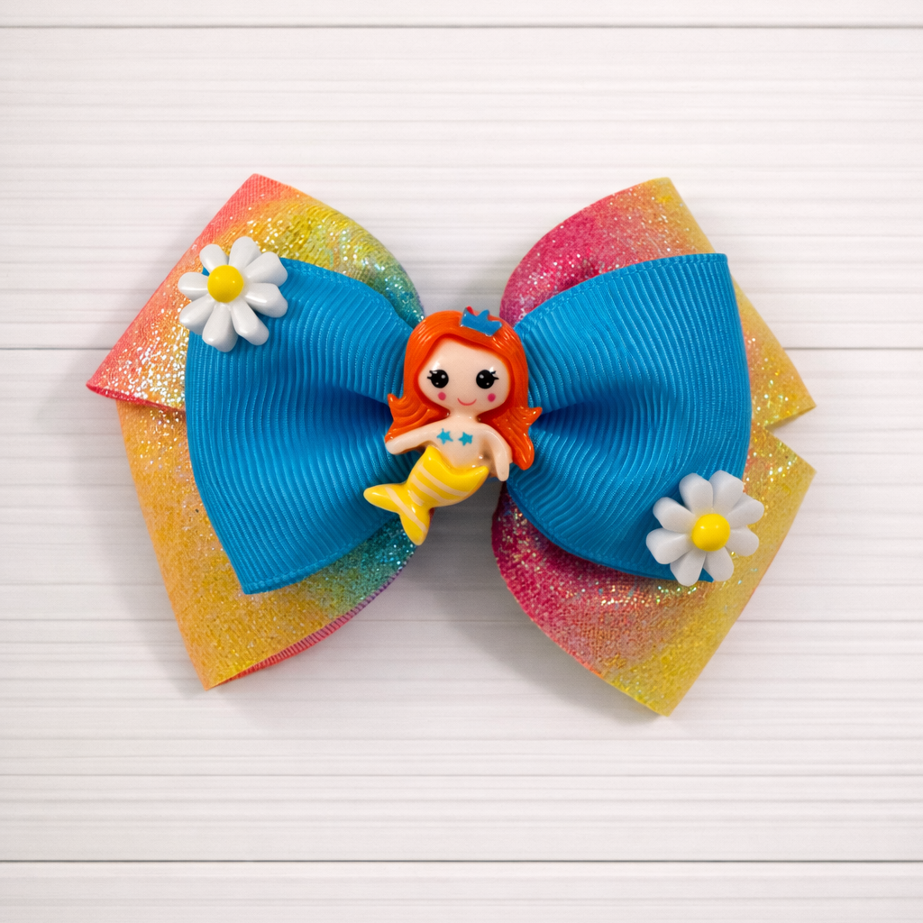Little girl's rainbow glitter bow with mermaid charm in middle and flower charms on sides