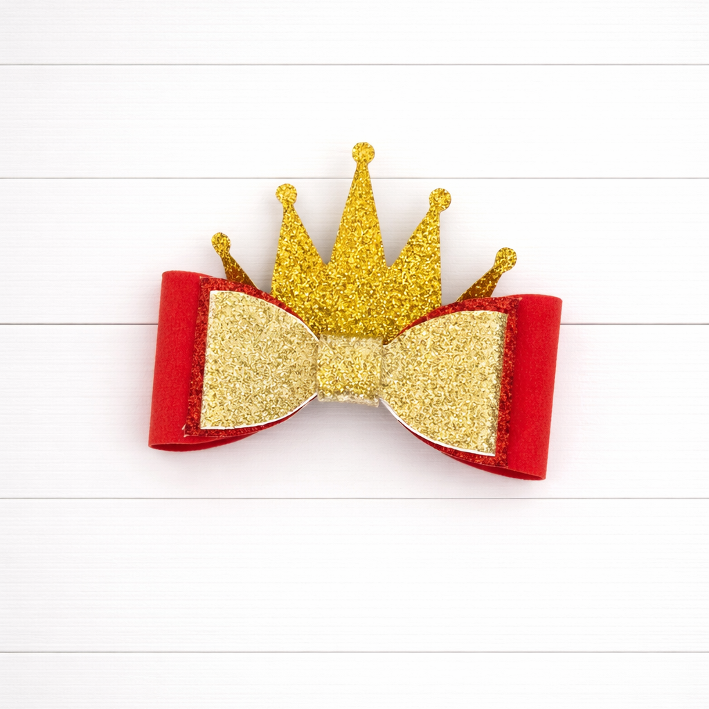 Hair bow with gold glitter crown and red base on a white background