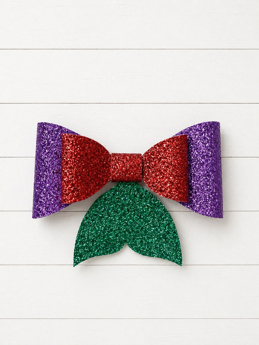 Glittery purple back bow with red glitter front bow with glitter green fin at the bottom