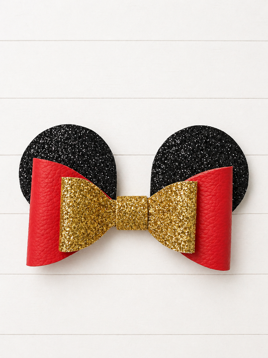 Black and red mouse ears with a gold bow on a white background