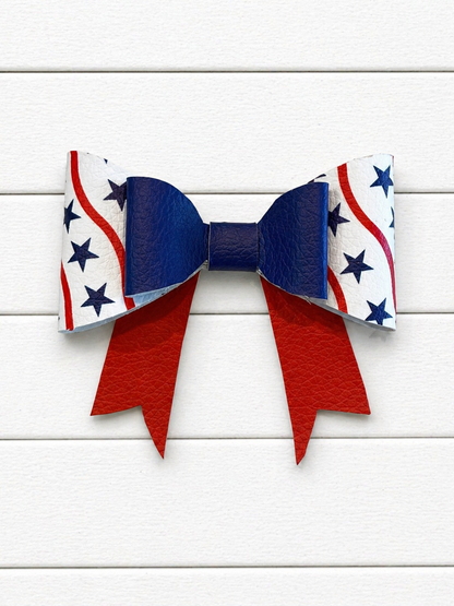 Bow with red, white, and blue pattern on a wooden background