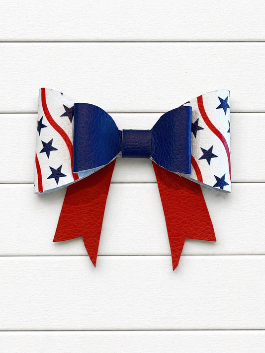 Bow with red, white, and blue pattern on a wooden background