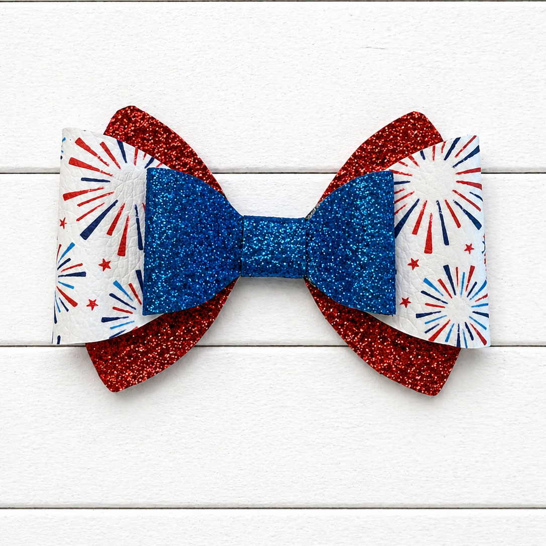 Red and blue glitter bows with fireworks design in the middle 
