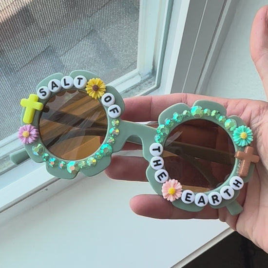 Video of Salt of the Earth sunglasses next to window for natural light