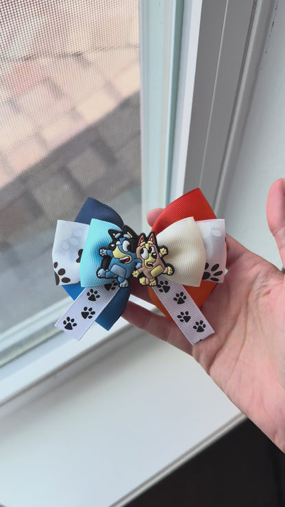 Video of sister pup bow next to window for natural light