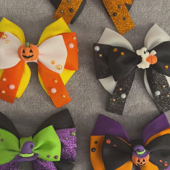 Video of all spooky crew bows on a grey background