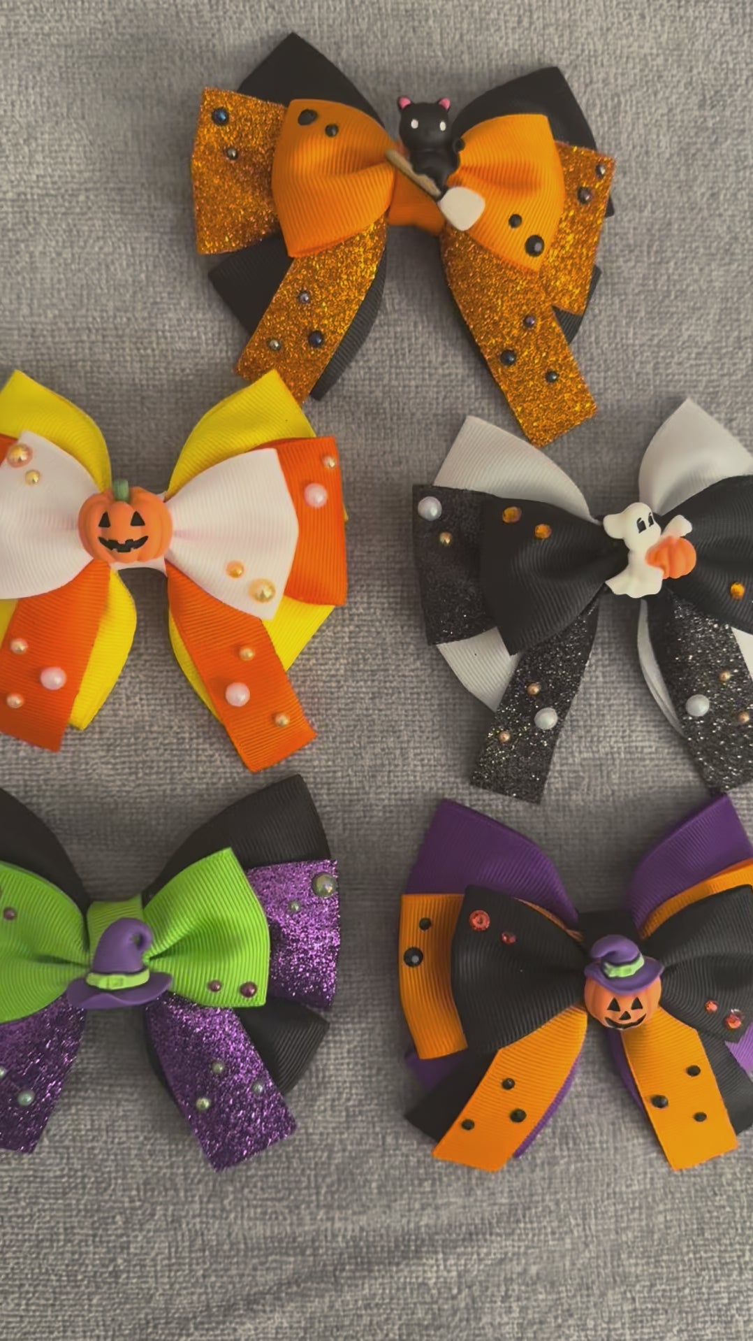 Video of all spooky crew bows on a grey background