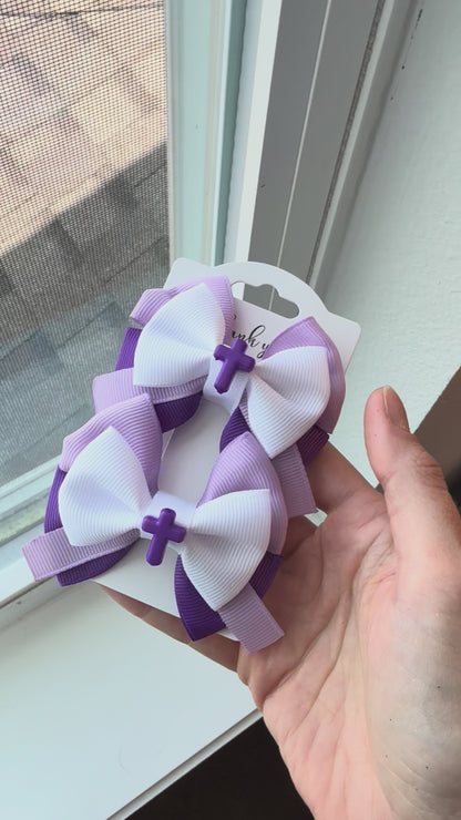 Video showing Purple Blessing Pigtail bows next to window in natural light