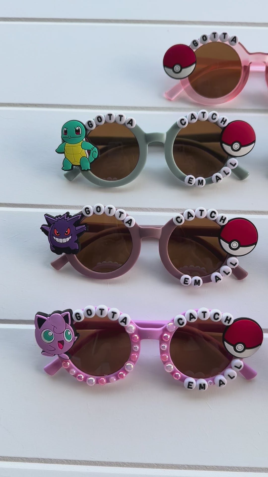 Video of all adventure trainer glasses on white paneled background