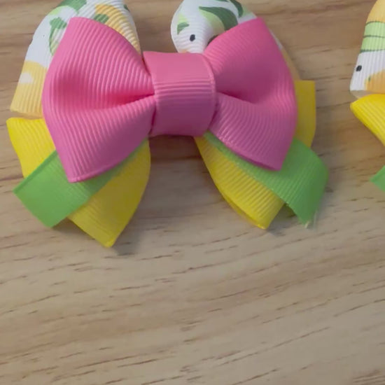 Video of pink lemonade pigtails on a wood background