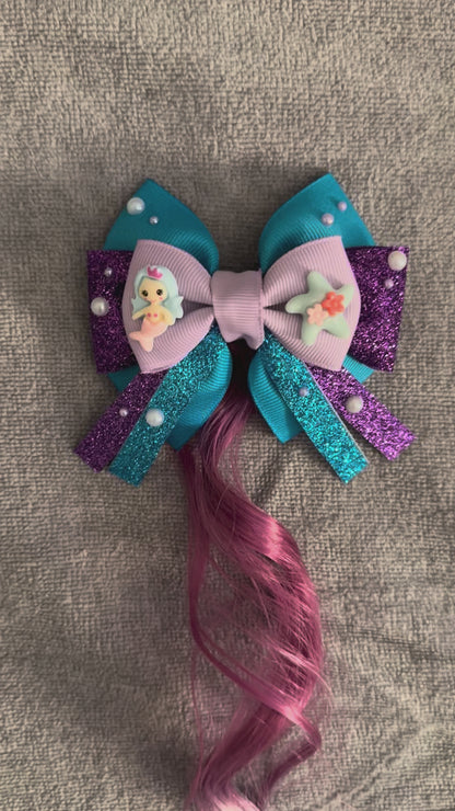 Video of mermaid bow with hair extension